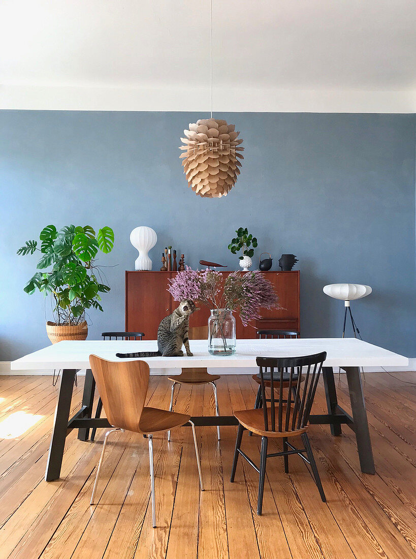 Dining room in mid-century style with blue wall