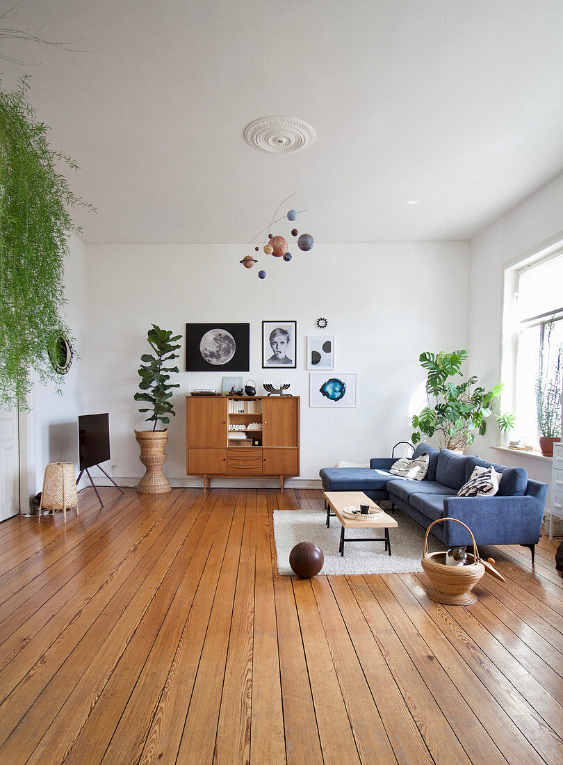 Large living room in mid-century style with wooden floor