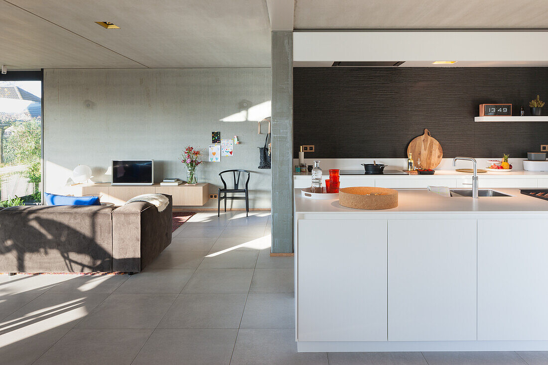 Open-plan living area with kitchen island and adjoining living room