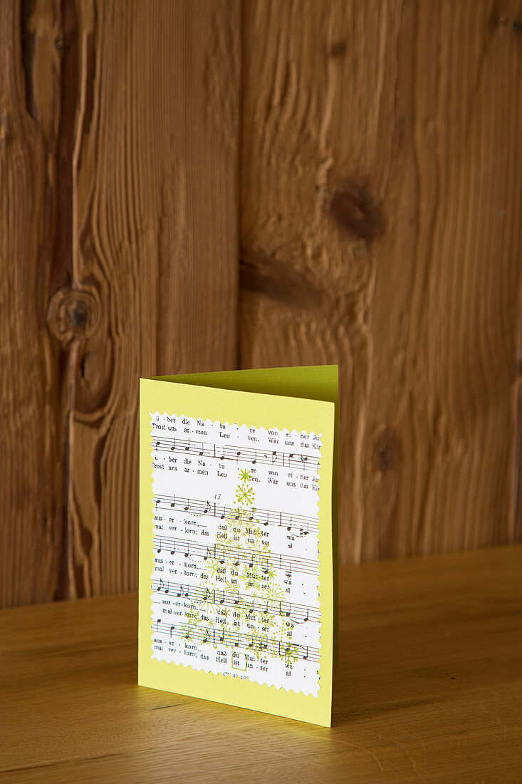 Handmade Christmas card with motif made from sheet music