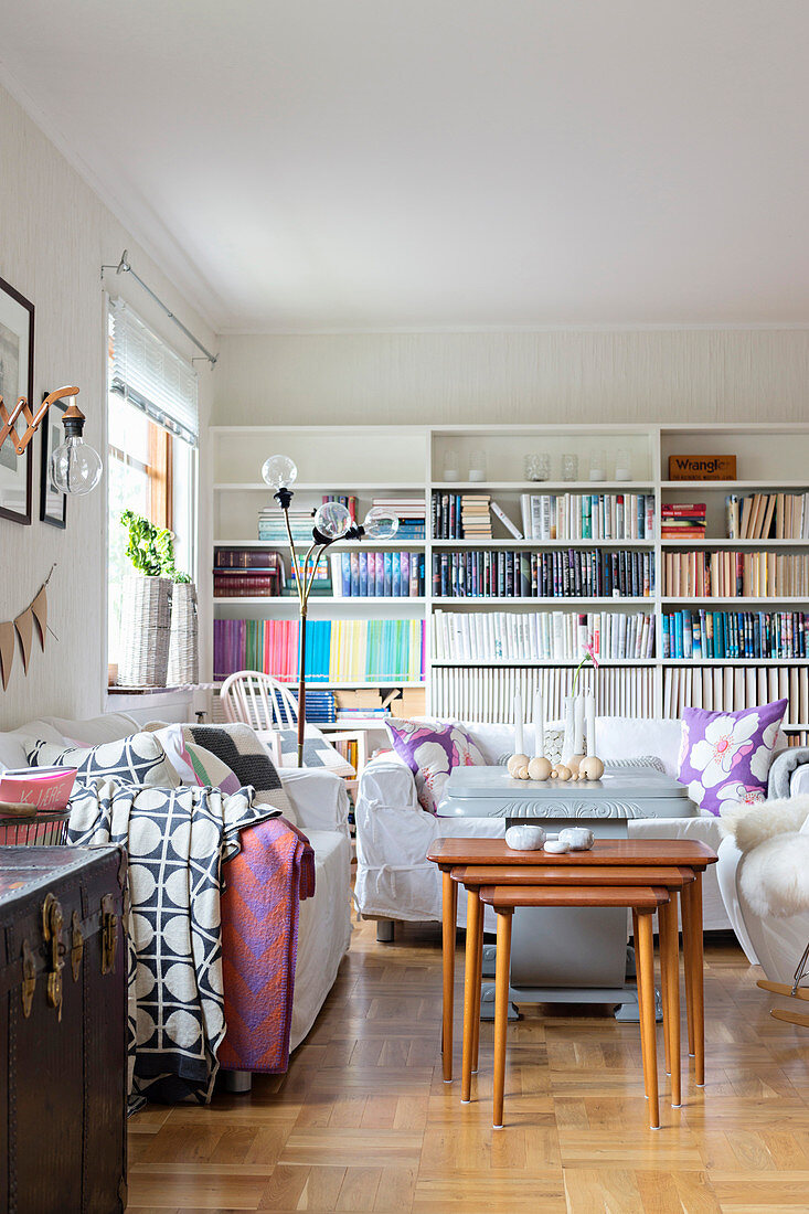 Tidy bookcases and white sofas in living room