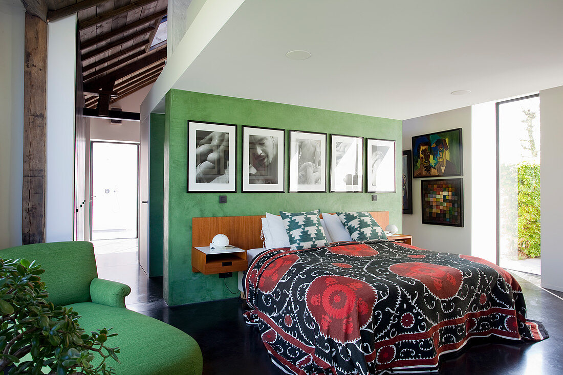 Bedroom with modern architectural elements and green wall