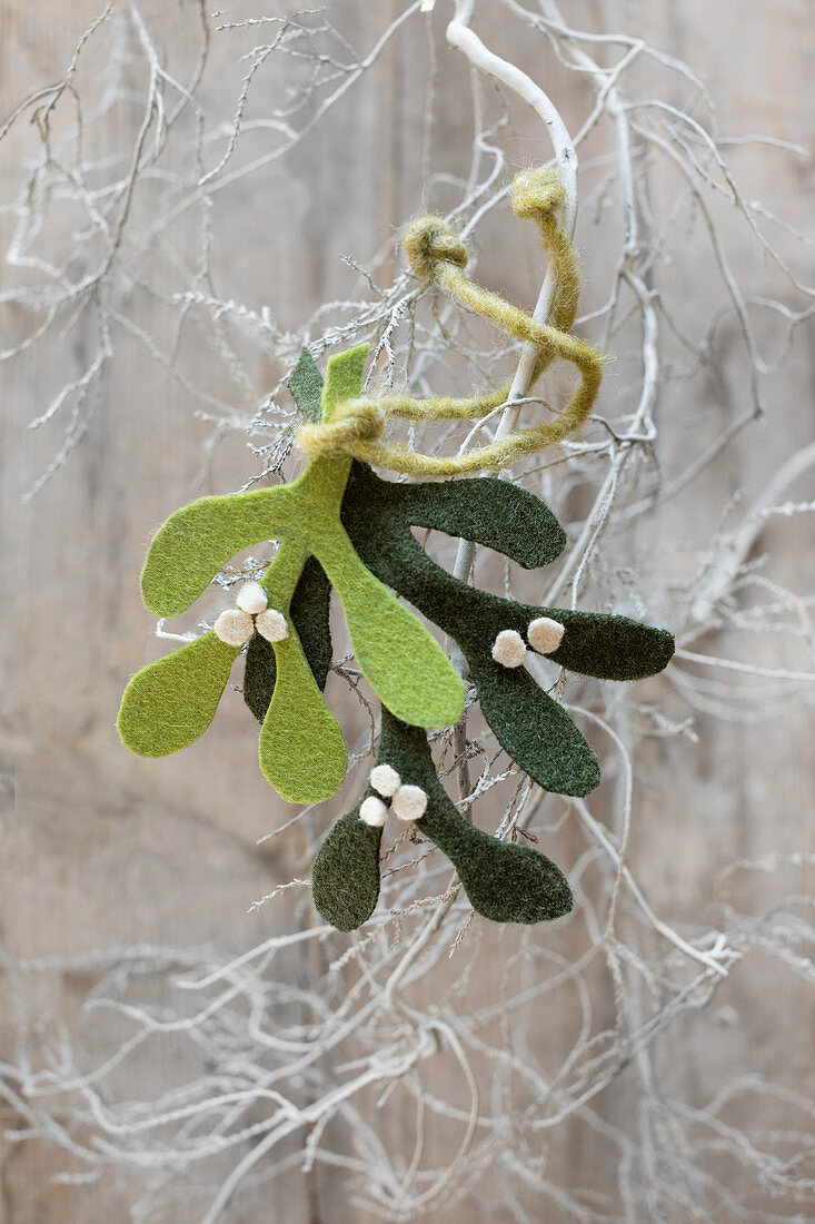 Festive arrangement of green felt mistletoe sprigs