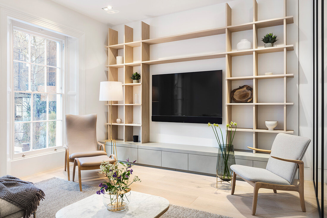 Shelves in bright, Scandinavian-style living room