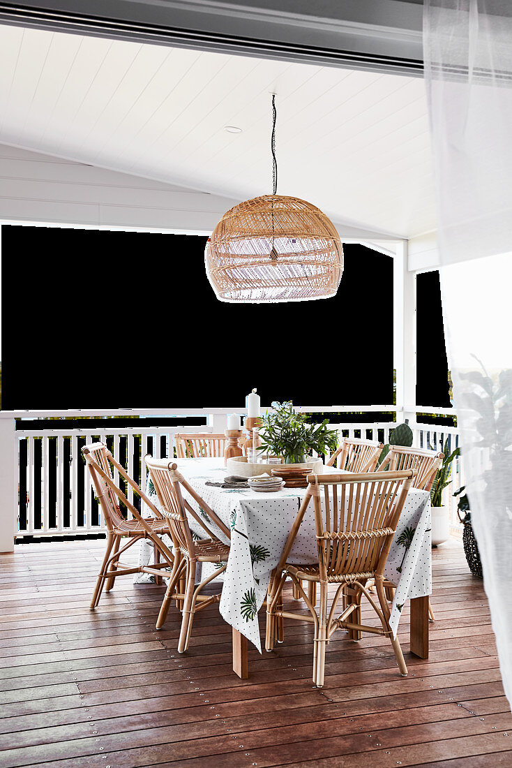 Dining table and rattan chairs on terrace