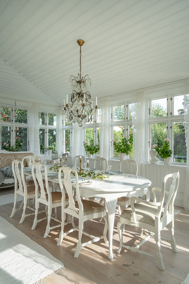 Dining room in antique Swedish style with conservatory windows