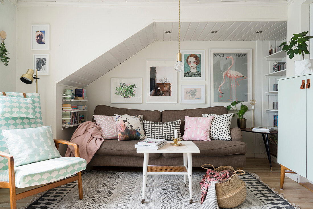 Vintage-style living room with sofa below sloping ceiling