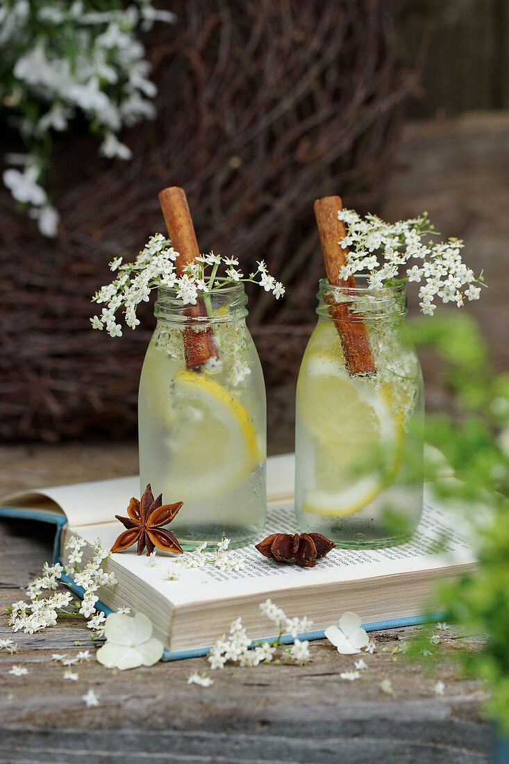 Lemonade with cinnamon sticks and elderflowers