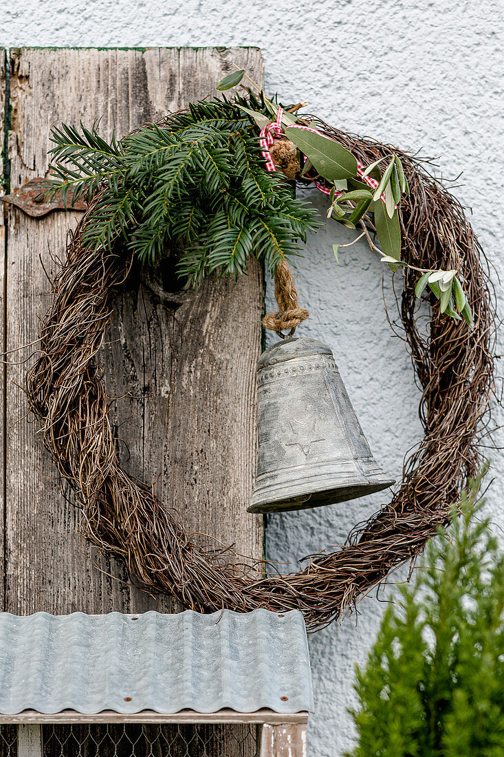 Mühlenbeckia wreath with yew tree, olive branch and bell