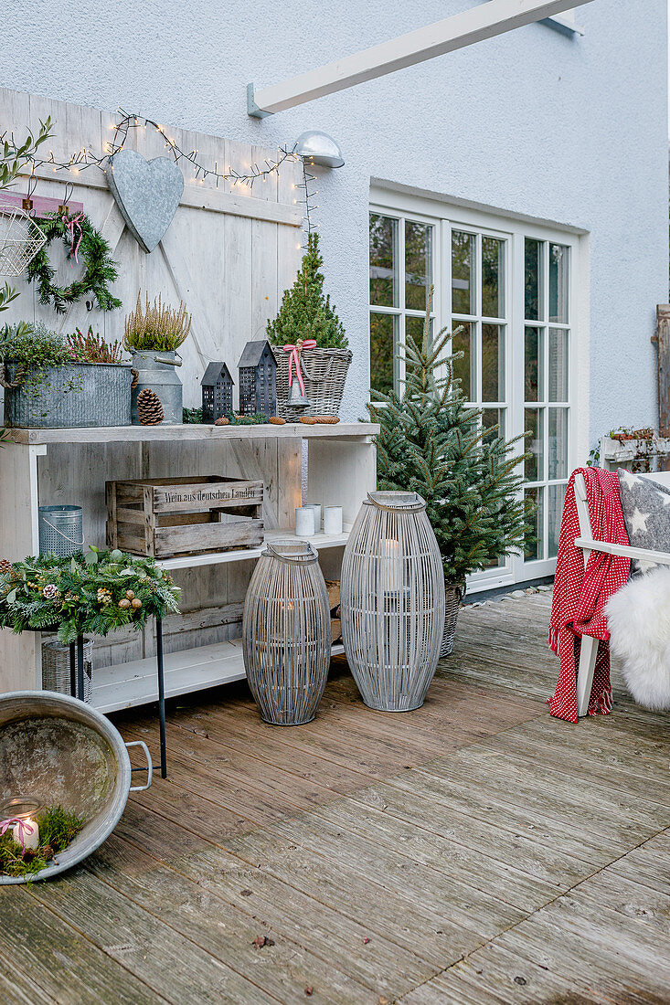Terrace with a Christmas tree on the Christmas decorated shelf
