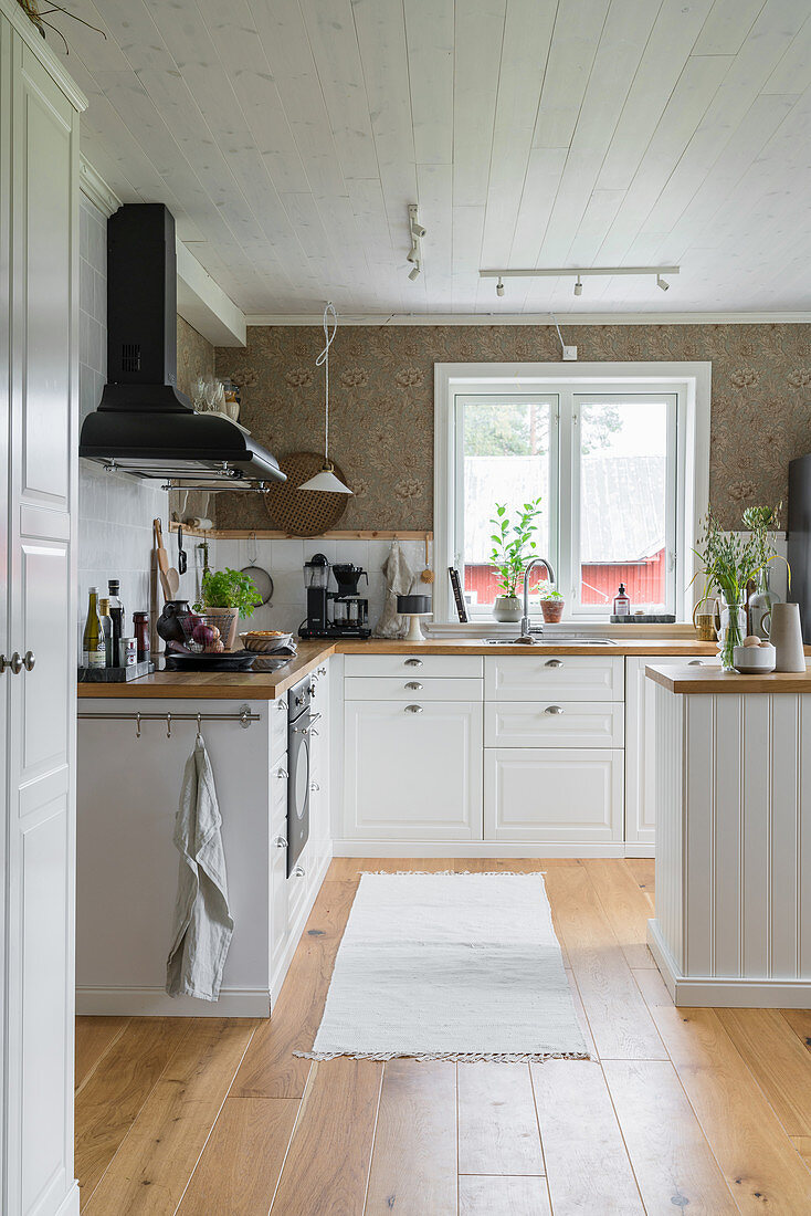 Kitchen in classic country-house style with white cabinets