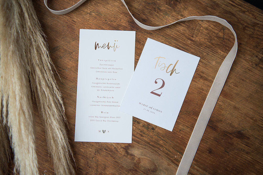 Wedding cards on wooden surface