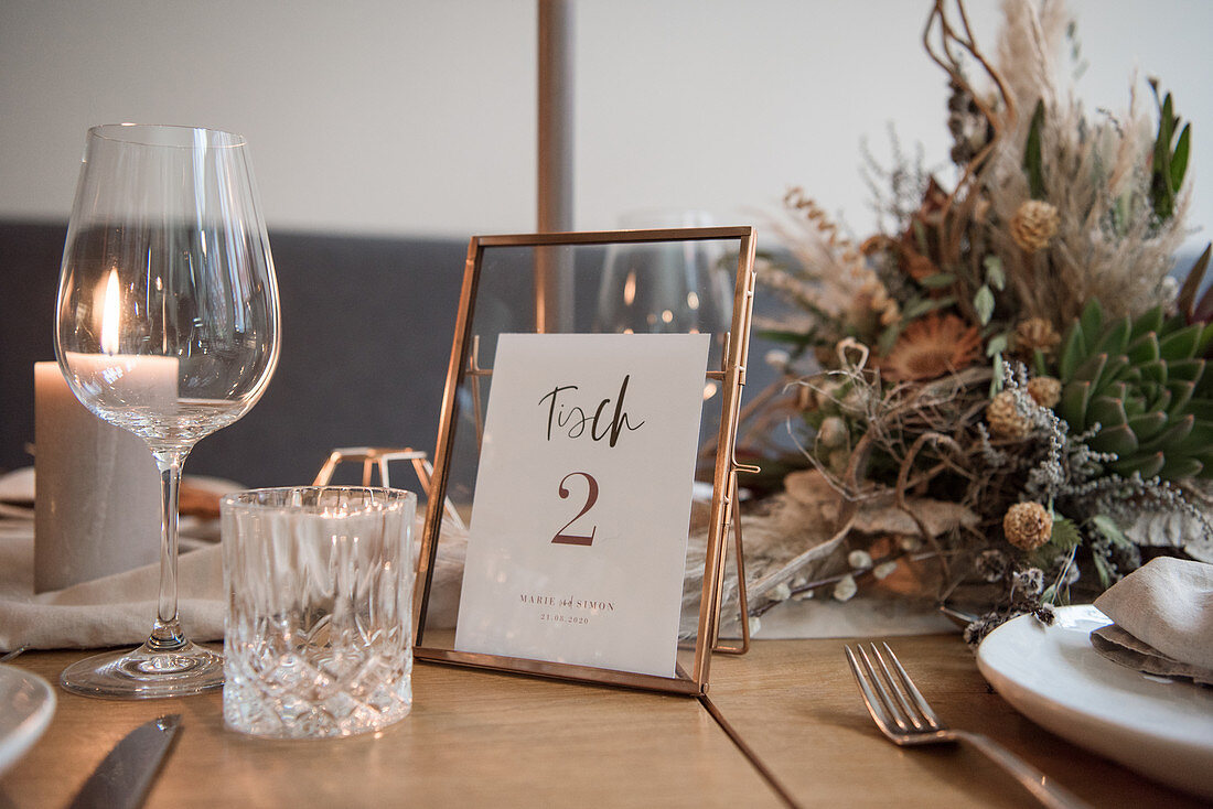 Table set for wedding with copper table number stand