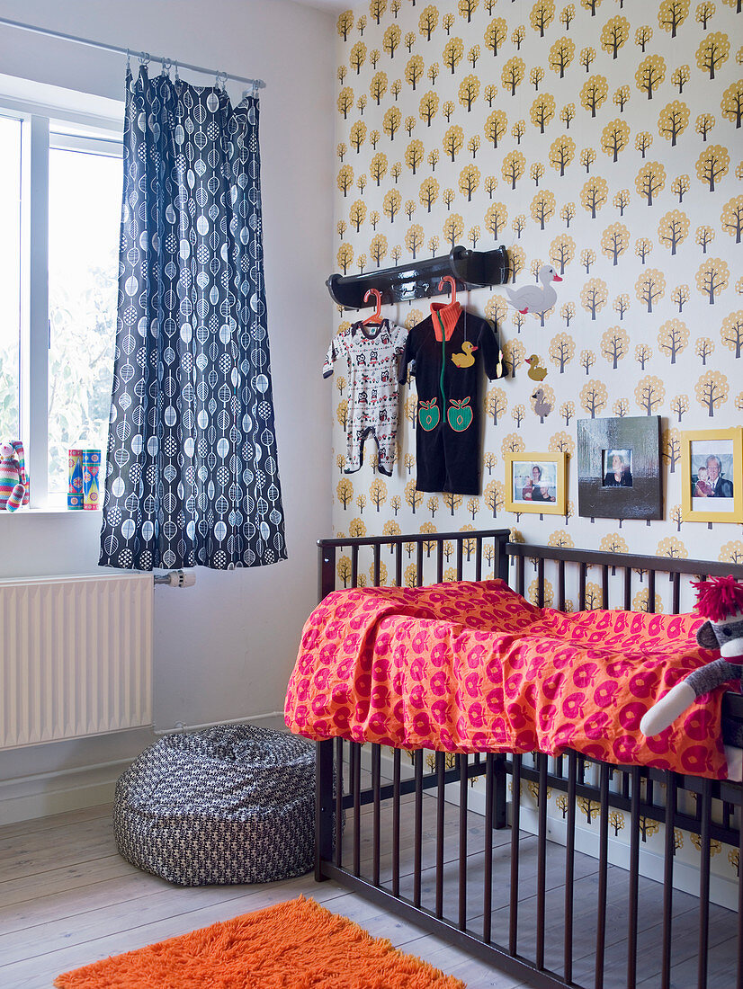 Various retro patterns and cot in nursery