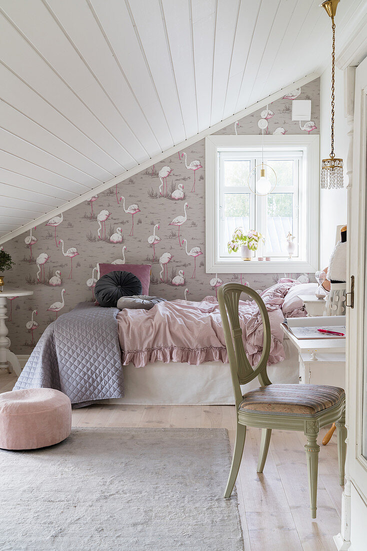 Girl's bedroom in pastel shades with sloping ceiling
