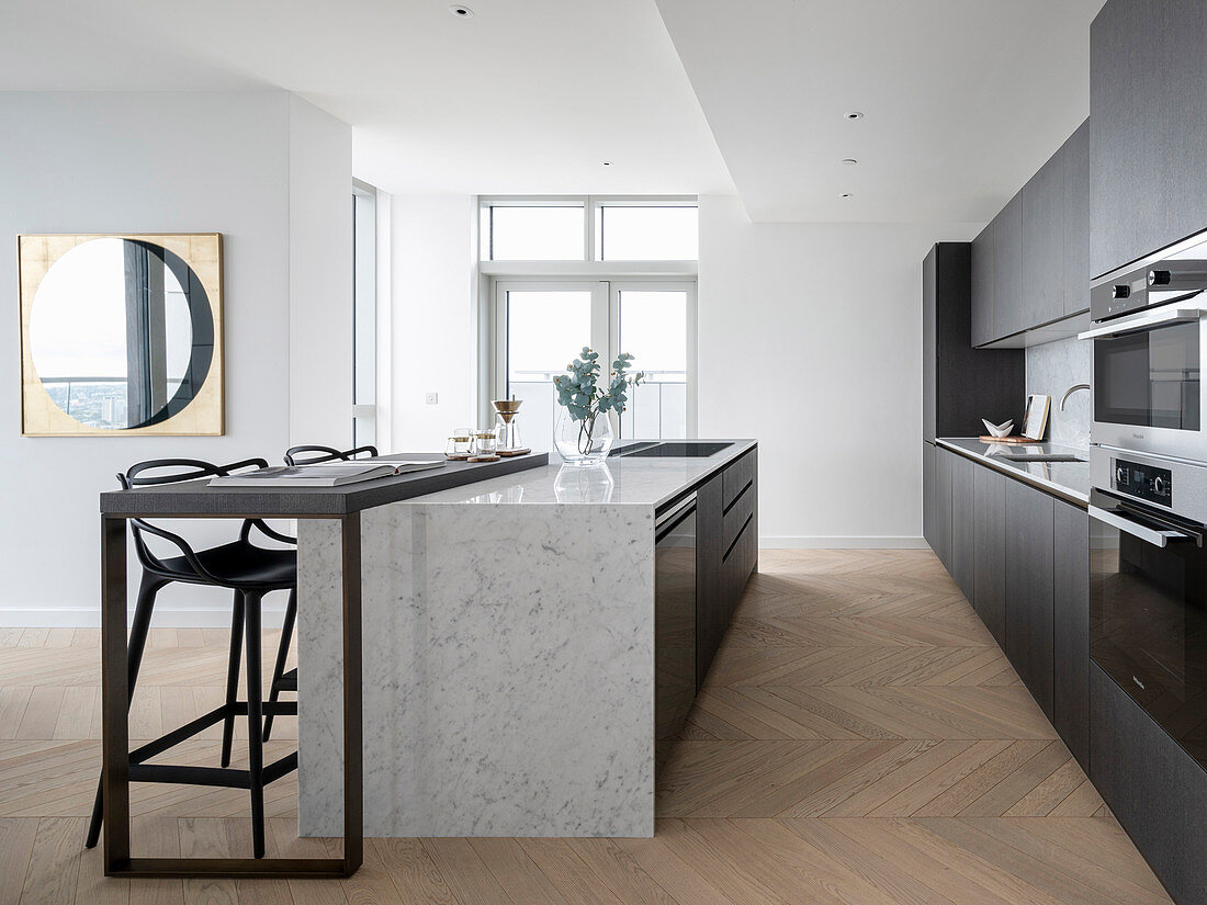 Modern, masculine kitchen in shades of gray with a kitchen island
