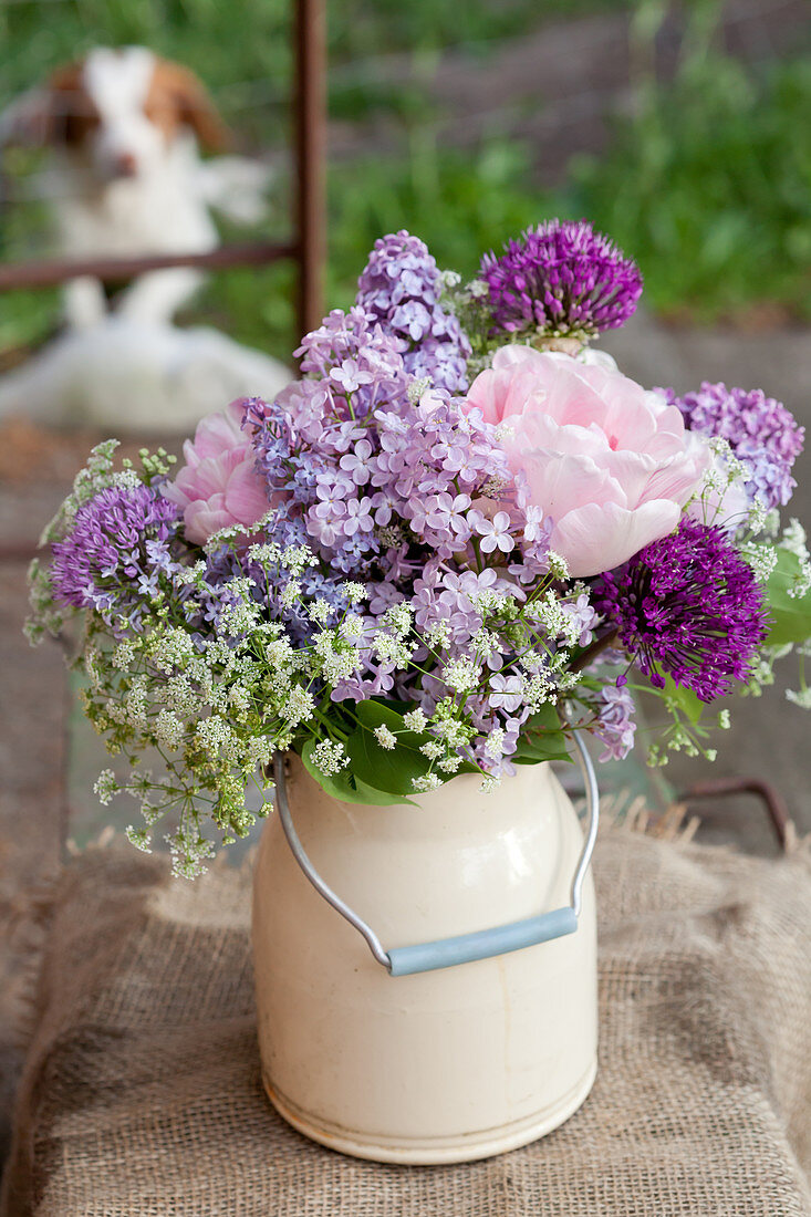 Spring bouquet of lilac, alliums, cow parsley and roses