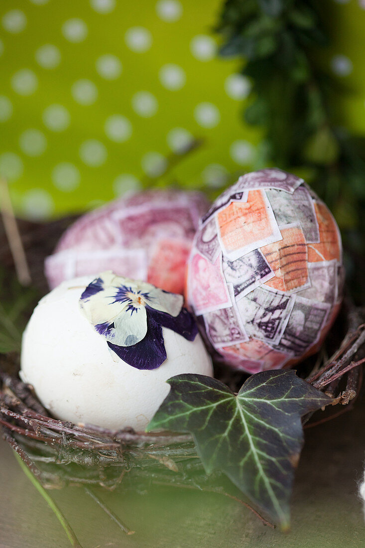 Easter eggs covered with old postage stamps