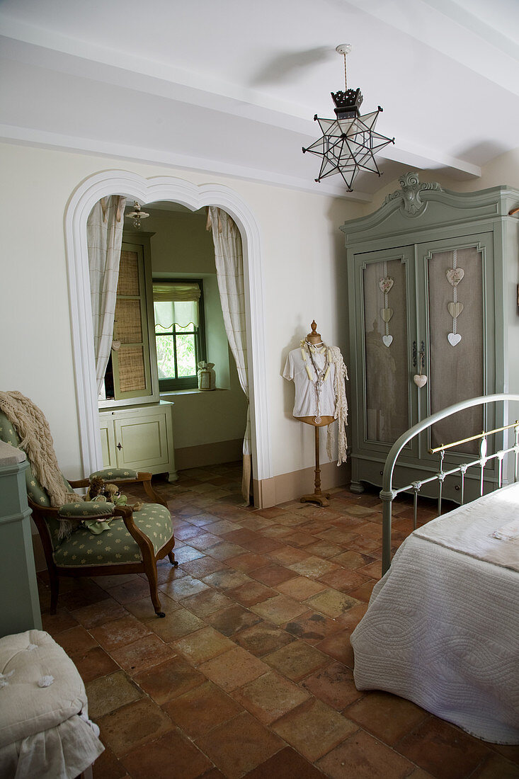 French-style bedroom with an entrance to the ensuite bathroom