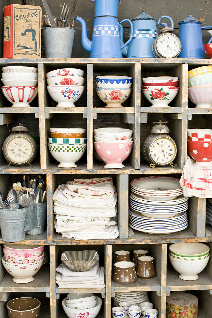 Various nostalgic dishes on an old shelving unit