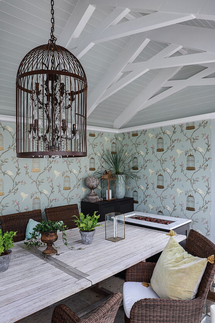 Birdcage lampshade above dining table