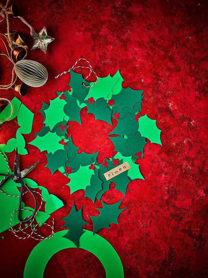 Handmade holly wreath for Christmas place setting
