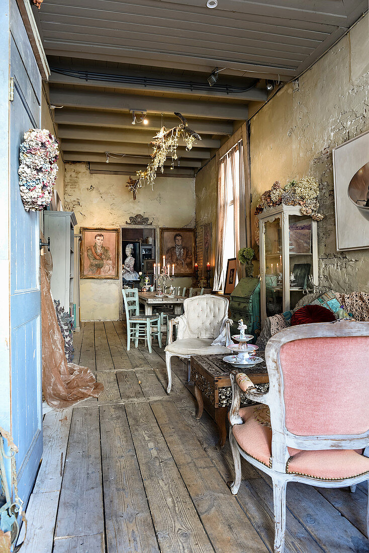 Vintage decorations in rustic interior of dilapidated house