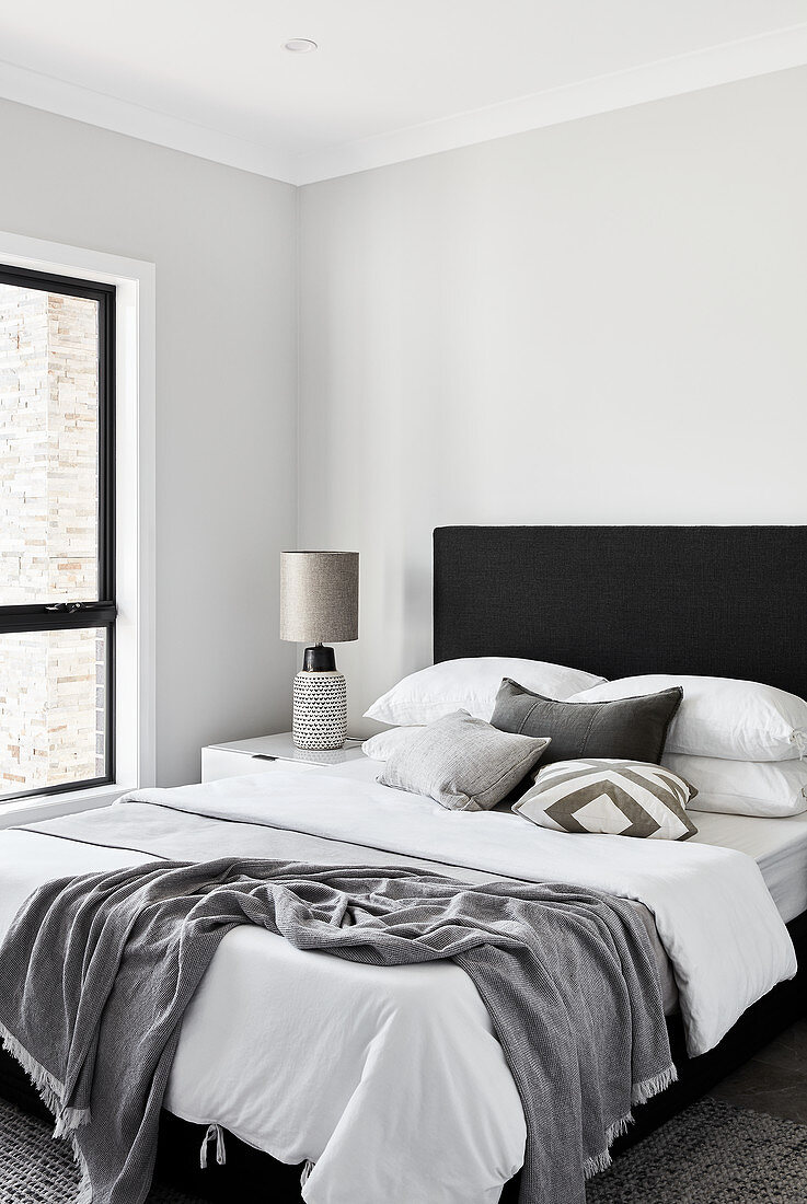 Modern bedroom decorated in black, grey and white