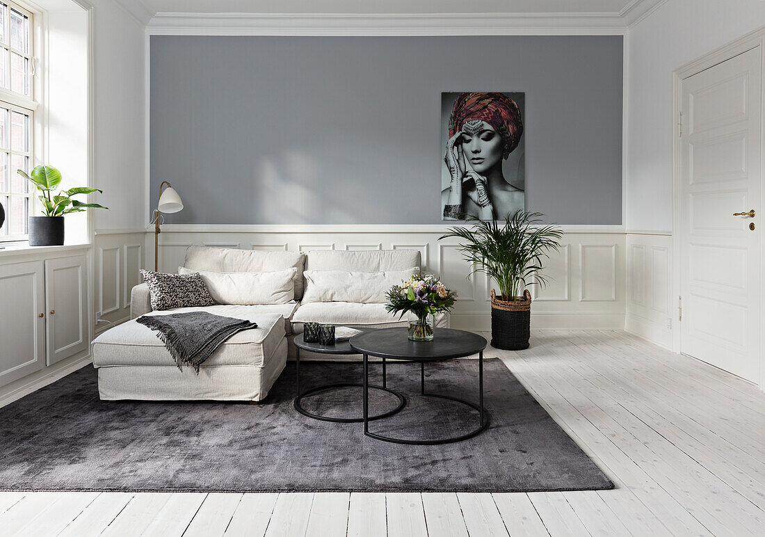 Classic living room in grey and white with wainscot paneled walls