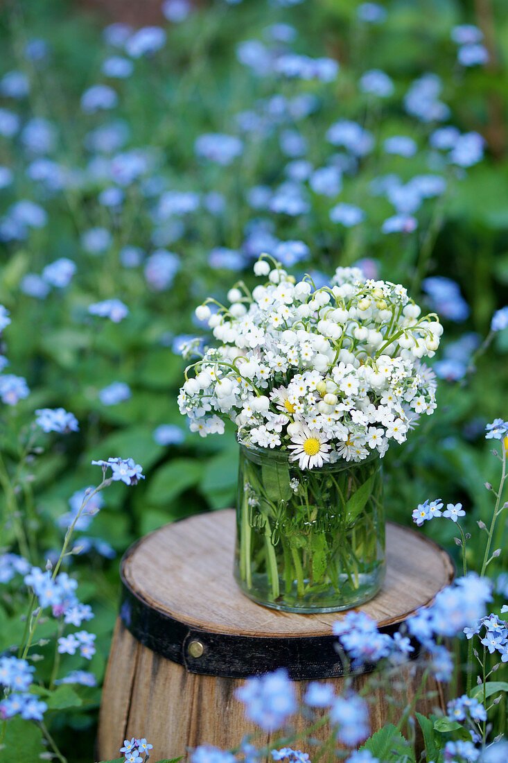 Bouquet of lily-of-the-valley, white forget-me-nots and daisies