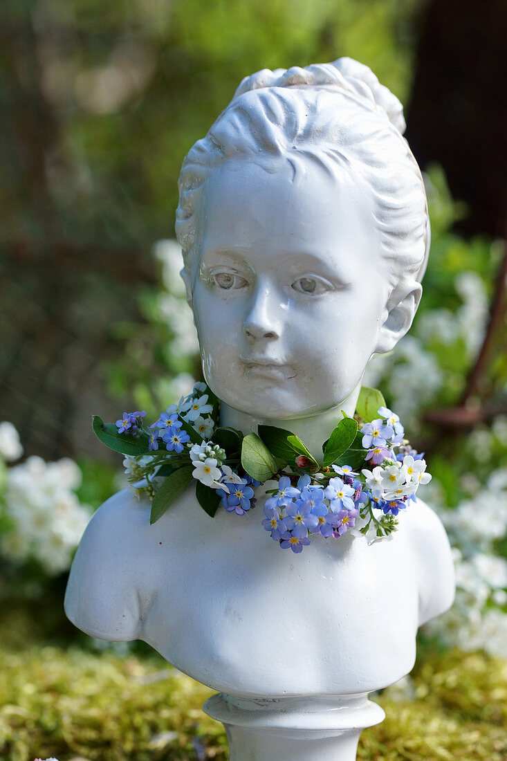 Bust of girl with wreath of forget-me-nots