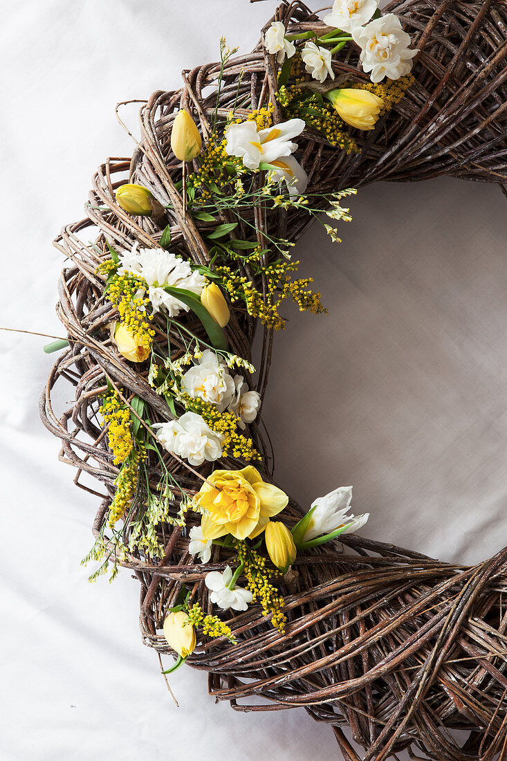 Spring wreath with daffodils, tulips, hyacinth, goldenrod, and sea lavender