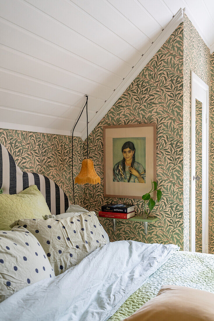 Vintage mixture of patterns in bedroom with sloping roof