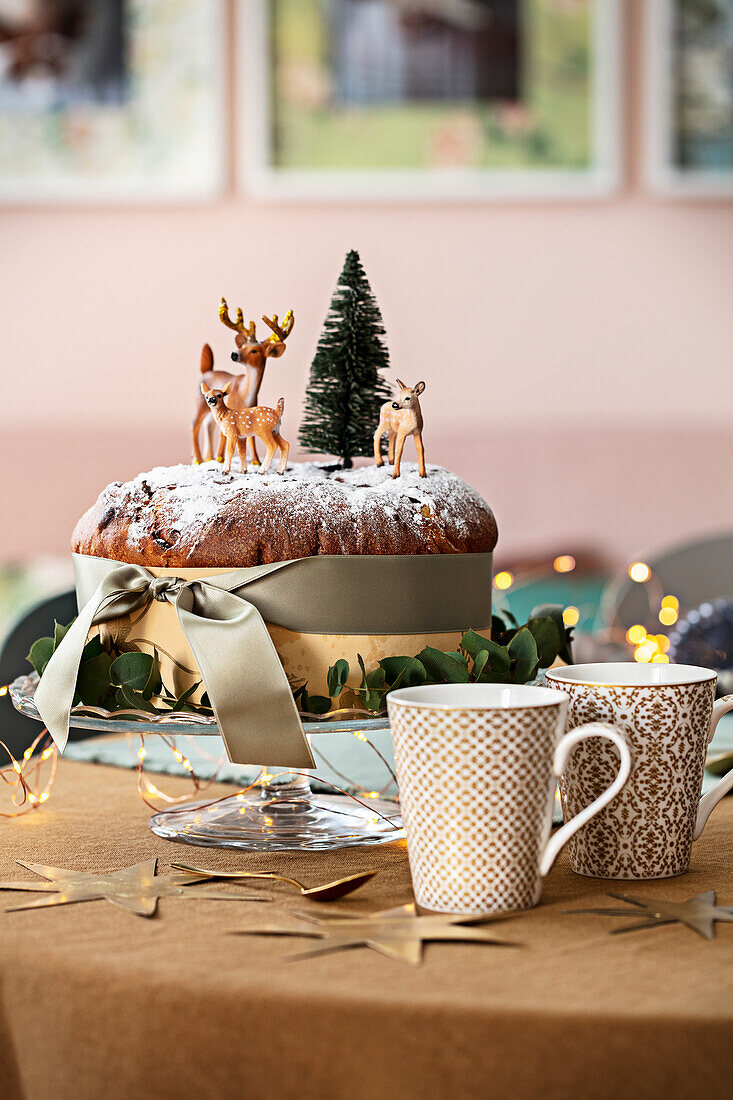 Christmas cake with animal figures and fir trees
