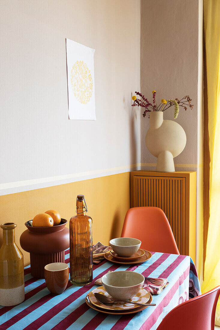 Small dining table with breakfast setting in the kitchen