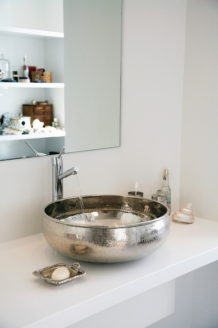 White washstand with silver countertop sink