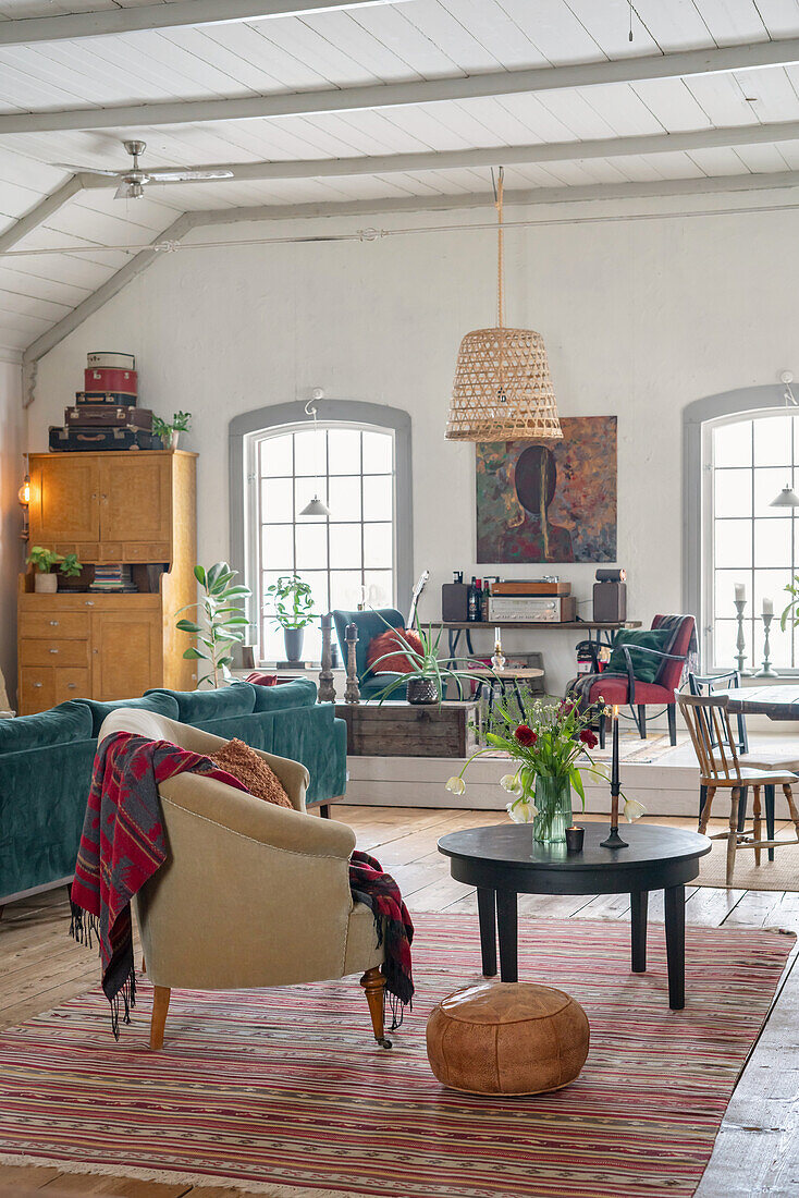 Open living room with vintage furnishings in a converted chapel
