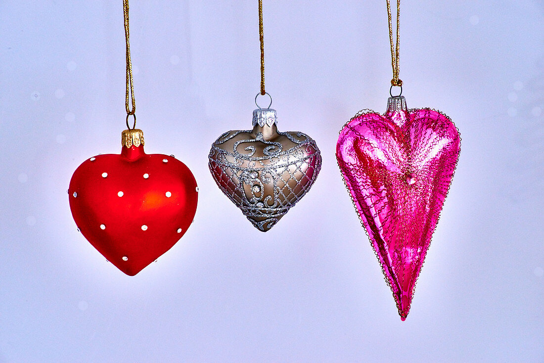 Christmas decorations in red, gold-and-silver and pink