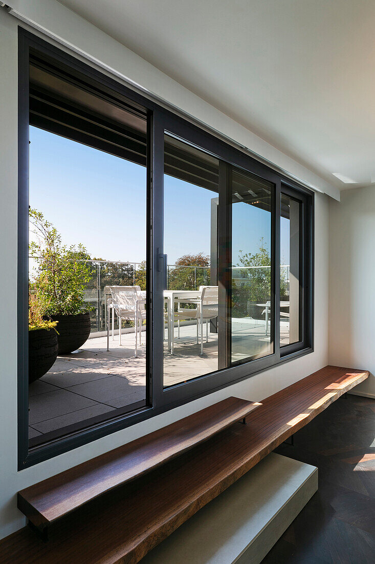 View through open sliding glass doors onto terrace
