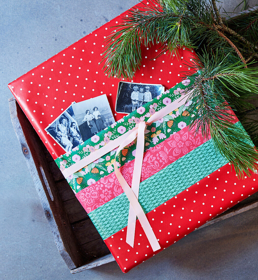Christmas gift wrap with old photos in pocket