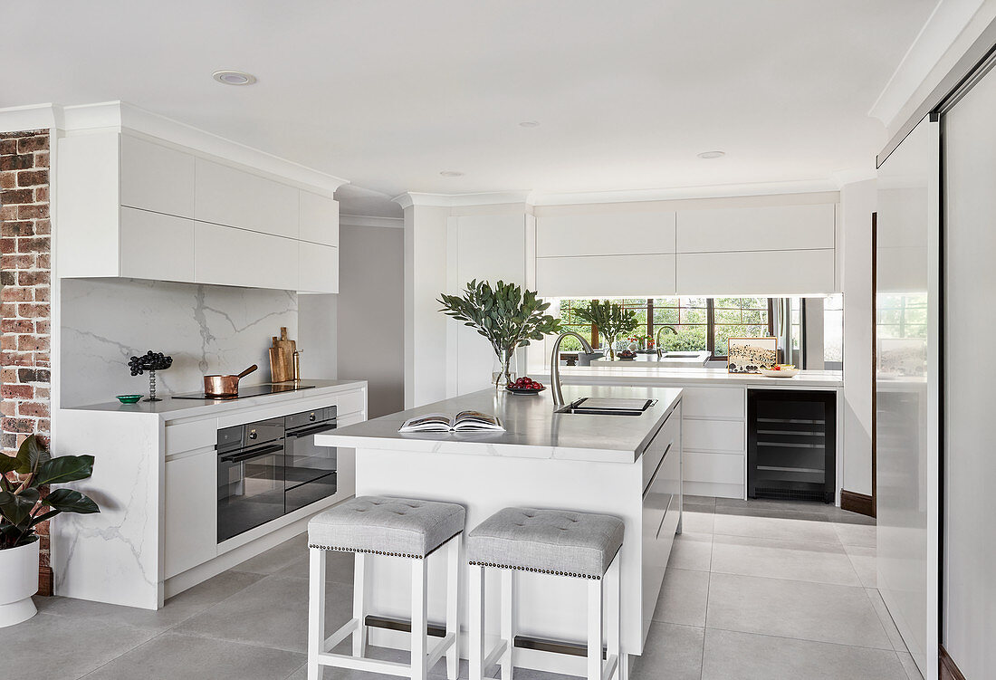 Island counter in elegant white kitchen