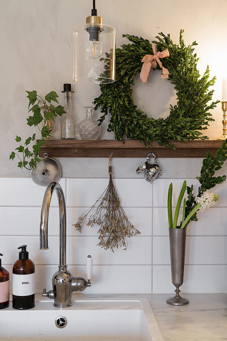 Wreath of beech and twigs as decoration in a country kitchen