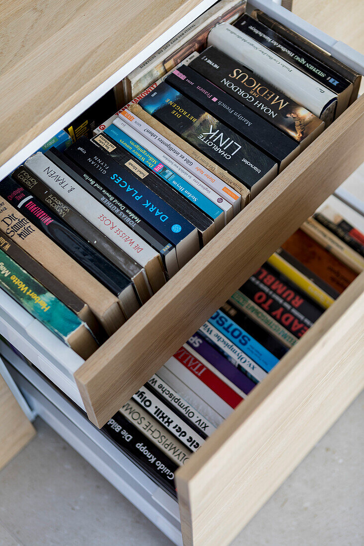 Books in pulled-out drawers