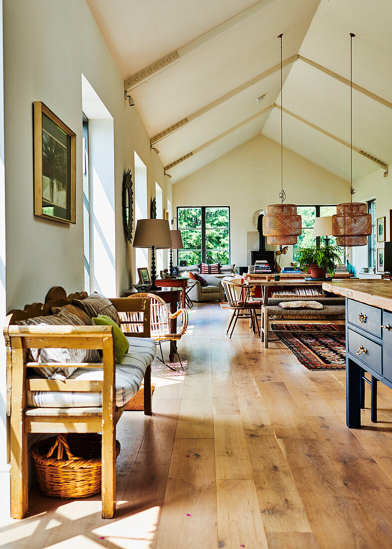Open-plan living room with oak floorboards