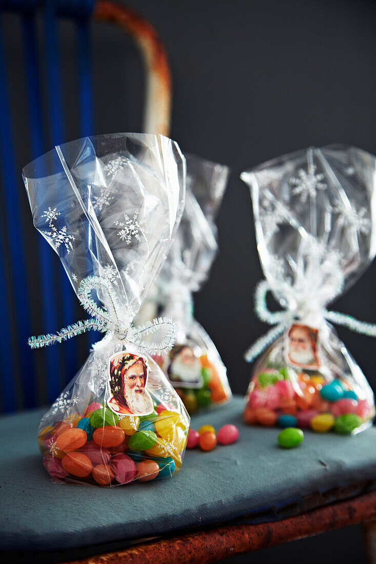 Gift bag with sweets and Father Christmas stickers on an old chair