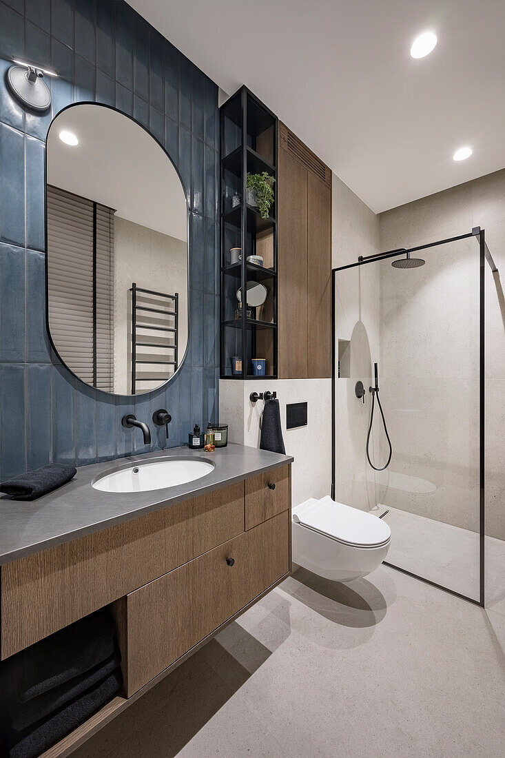 Elegant bathroom with washbasin and glass shower cubicle