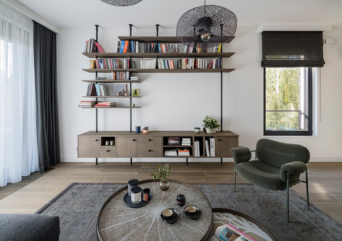 Coffee table set, armchair and bookshelves-sideboard combination in living room