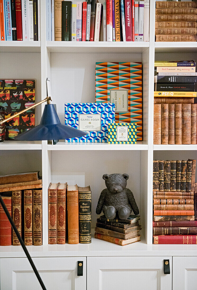 Bookcase with bear figurine