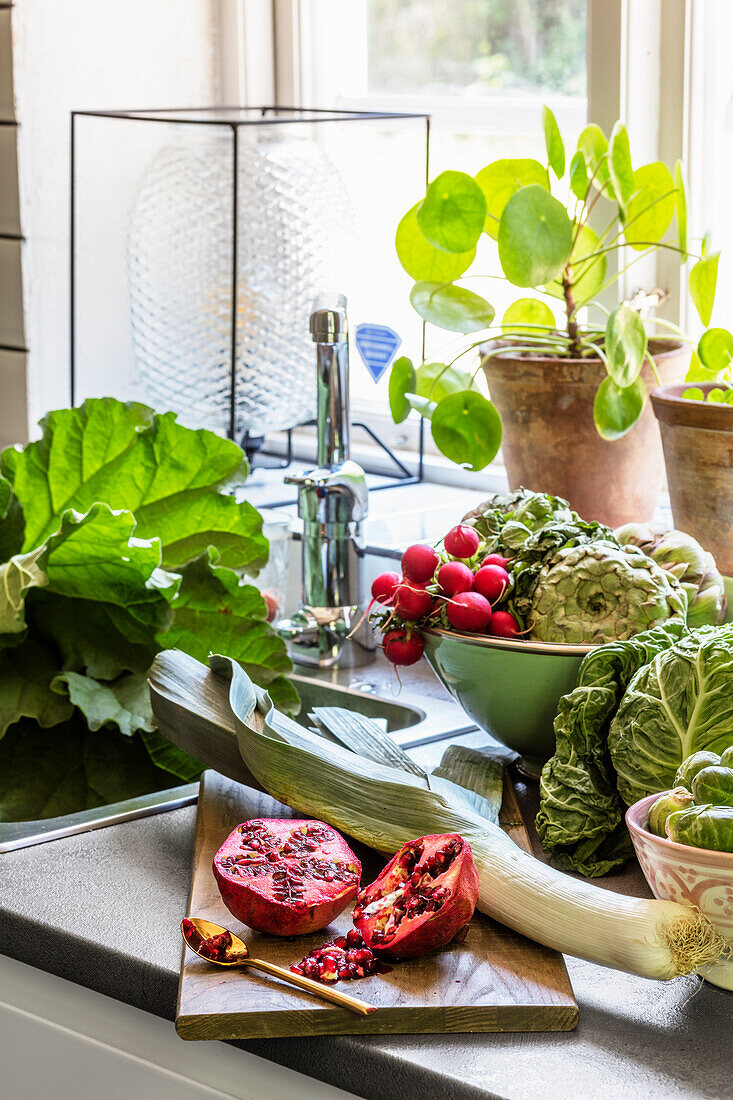 Fresh vegetables and fruit on a kitchen counter
