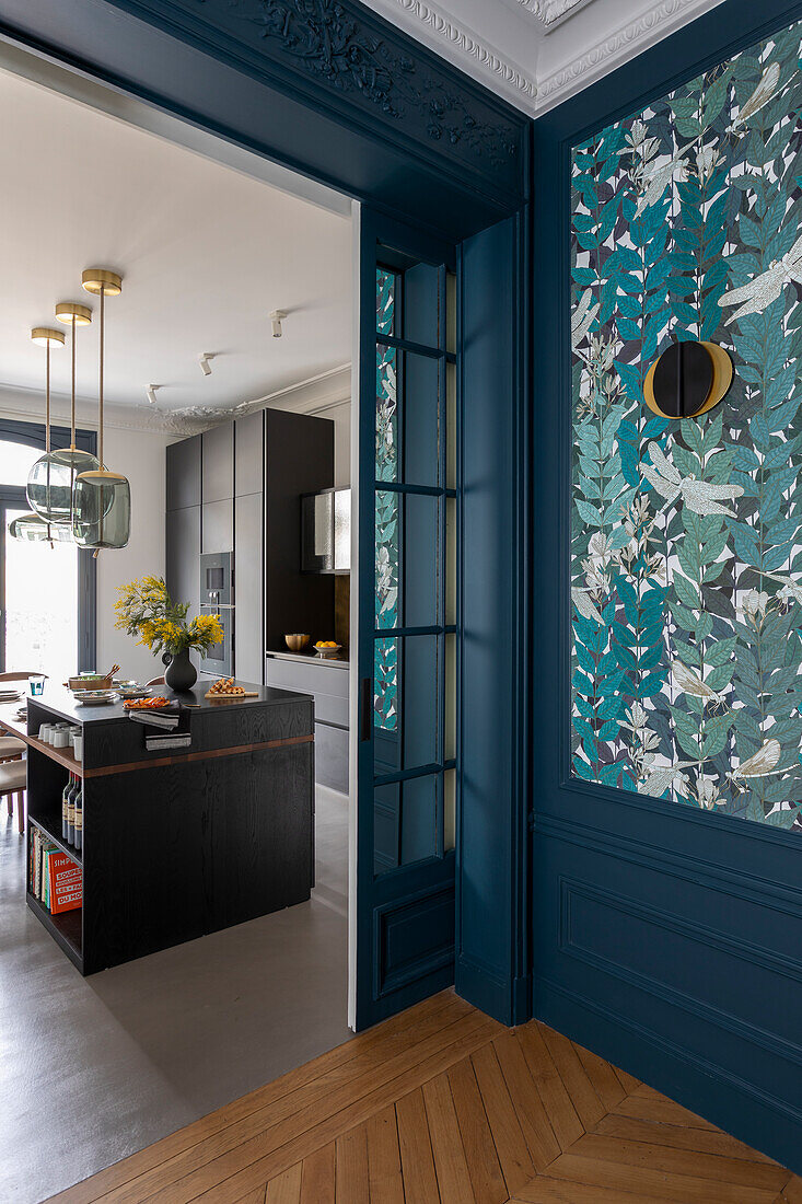 Hallway with floral wallpaper and view of kitchen